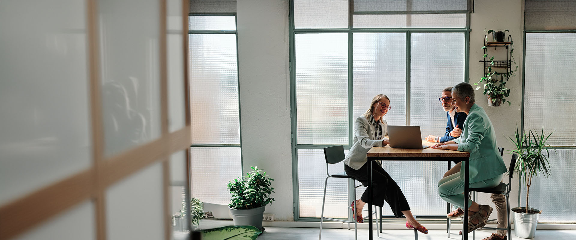 A financial advisor meeting with clients