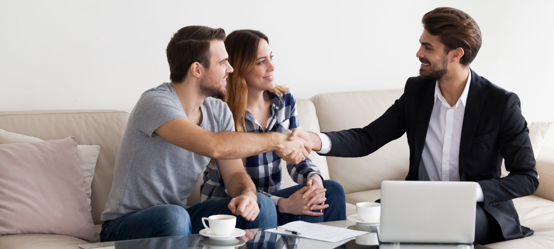 Real estate agent shaking hands with customer