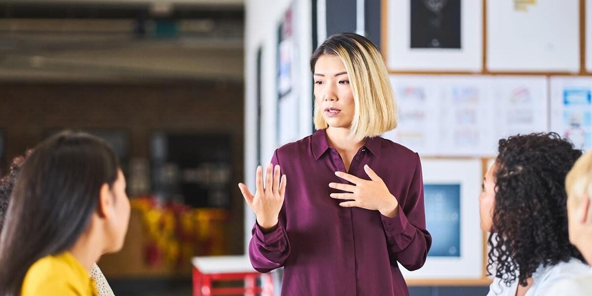 Woman presenting to colleagues